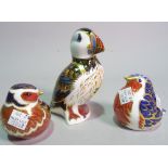 Three Royal Crown Derby paperweights all modelled as birds, including a Puffin.