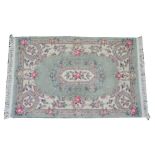 A Chinese rug, sage floral field, 196cm x 125cm. Condition Report Very good.