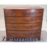 A George III mahogany bowfront chest of two short and three long graduated drawers,