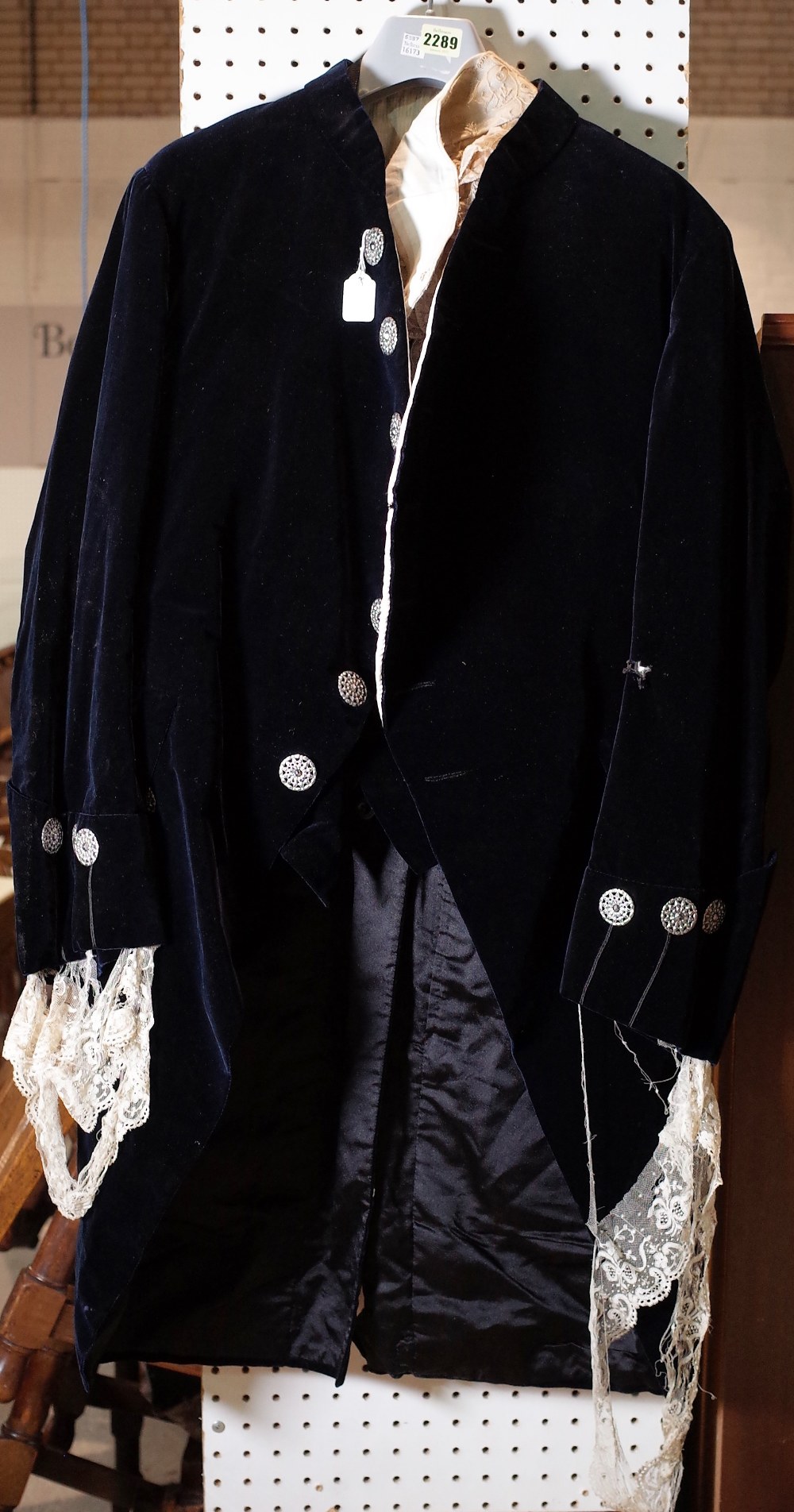 An 18th century style velvet costume, comprising; a waistcoat, jacket, trousers, a pair of gloves,