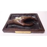 A modern relief bronze sculpture of a hand, 19cm wide.