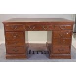 An early 20th century walnut pedestal desk,