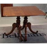 A Regency style mahogany 'D' end dining table on turned column and outswept supports,