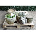 Garden statuary including a pair of early 20th century reconstituted stone wall hanging plaques,