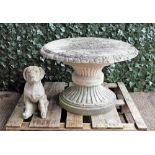 A reconstituted stone circular table on flared base, 90cm diameter x 62cm high,