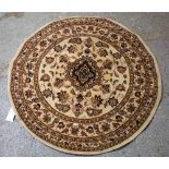 A round machine made rug, 133cm diameter.