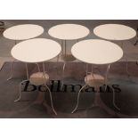A set of five modern white painted metal circular two tier occasional/ cafe tables,