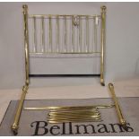 A modern brass double bed