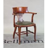 An early 20th century stained beech tub back office chair