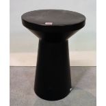 A modern black painted metal circular occasional table