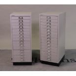 ‘Bisley’, a pair of grey painted metal filing cabinets with fifteen short drawers, 35cm wide x...
