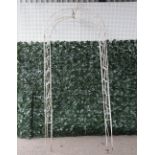 A early 20th century white painted metal garden arch, 100cm wide; 225cm high (a.f)