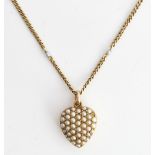 A gold and seed pearl set heart shaped pendant locket, the front pave set with seed pearls,...
