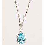An 18ct white gold, aquamarine and diamond pendant, claw set with the pear shaped aquamarine...