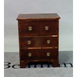 A 19th century mahogany commode converted to a side cabinet with pair of drawers