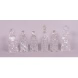 Glassware including a group of six early 20th century cut glass decanters, the tallest 18cm...