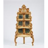 A late 19th century Italian Rococo revival white painted parcel gilt graduated corner shelf...