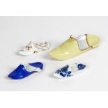 A Meissen porcelain slipper, late 19th century, yellow with puce sole and gilt rim, blue...