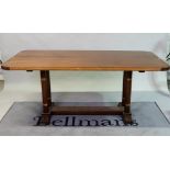 An Art Deco style rectangular walnut dining table