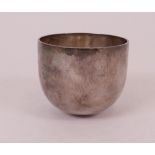 A silver tumbler cup, having martele decoration, height 7cm, London 2010, maker's mark DEC,...