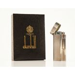 A Dunhill gas lighter, detailed tot he underside '20 MICRONS' with serial number D12935, boxed...