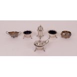 A group of silver condiments, comprising; a four piece condiment set, each piece of shaped...