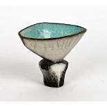 Elizabeth Raeburn ( born 1943), a raku glazed footed vessel