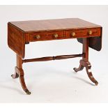 A Regency rosewood banded mahogany sofa table with a pair of frieze drawers on four downswept...