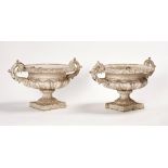 A pair of Victorian white painted cast-iron urns