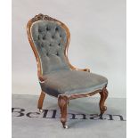 A Victorian mahogany framed nursing chair with buttonback upholstery