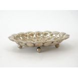 A European shaped oval dish, of panelled form, radiating from the centre within a lobed rim,...