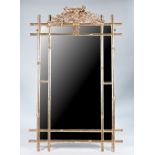 A silver painted rectangular mirror with faux bamboo marginal border and foliate crest, 119cm...