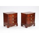 A pair of George III style mahogany serpentine three drawer bedside tables on bracket feet,...
