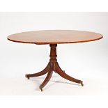 A George III style oval satinwood banded centre table on four downswept supports, 152cm wide x...