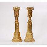 A pair of Gothic-Revival style giltwood altar sticks