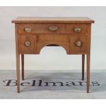 A George III mahogany sideboard with three frieze drawers on tapering square supports,