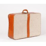 A leather and canvas Hermes suitcase, (a.f). 67cm x 47cm