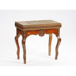 An early 20th century Middle Eastern extensively parquetry inlaid fold-over games table.