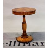 A William IV style mahogany and ebony banded circular occasional table on a turned column