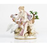 A Meissen outside decorated group of Leda and the Swan, late 19th century, the maiden seated...