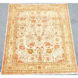 A Pakistan rug, the beige field with an allover floral design in complementary colours, 244cm...