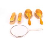 A silver and yellowy/orange enamelled five piece lady's dressing set, comprising; a hand...