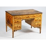 A 19th century chinoiserie decorated writing desk with five drawers about the knee on tapering...