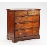A George III oak chest with two short and three long graduated drawers on bracket feet, 108cm...