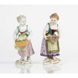 Two Meissen figures of girls, late 19th and 20th century, the first carrying a rectangular...