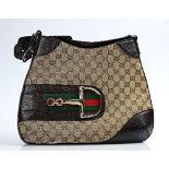 A Gucci canvas and brown leather shoulder bag
