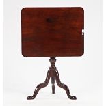 An 18th century mahogany occasional table, the rectangular snap top on turned column and...