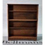 A mid-20th century walnut two-tier open bookcase