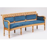A Charles X bleached elm bow back sofa with star pierced crest rail and shepherd's crook arms...