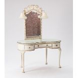 A mid-20th century white painted kidney shape dressing table with lamp mounted swing mirror...